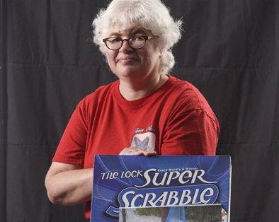 Carol Patenaude next to The Lock: Super Scrabble