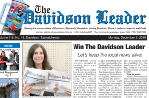The front page of the Davidson Herald paper. Under the title of the paper is a photo of Tara de Ryk on the left, holding two papers. On the right is an article called "Win The Davidson Herald!" with the subhead "Let's keep local journalism alive." 