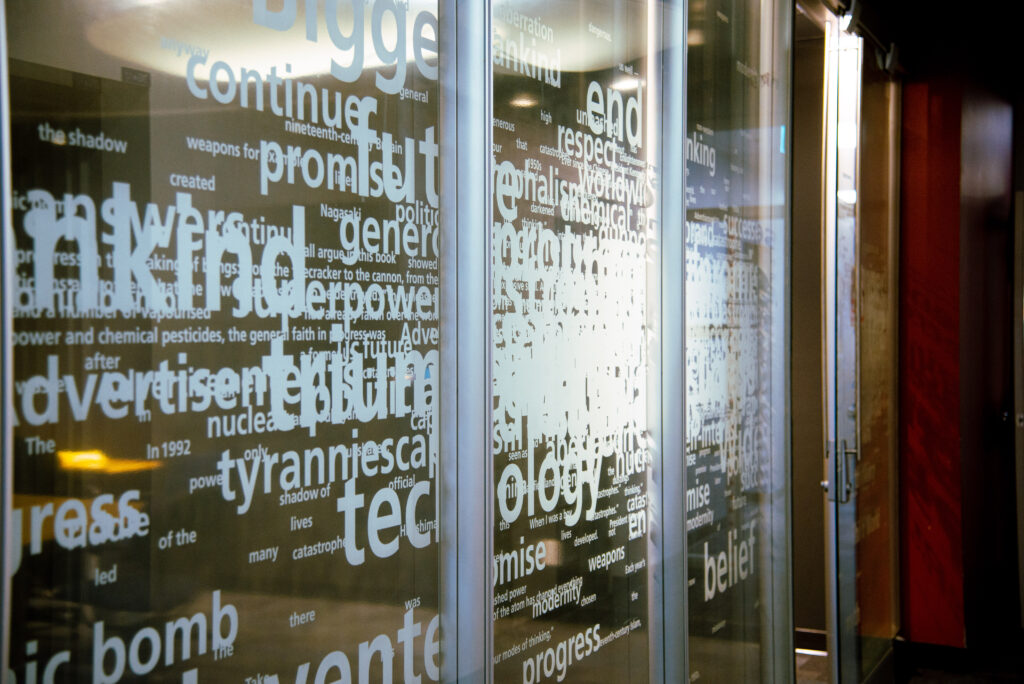 A glass-walled room on the third floor of the CBC Toronto broadcast centre with a words printed on the glass.