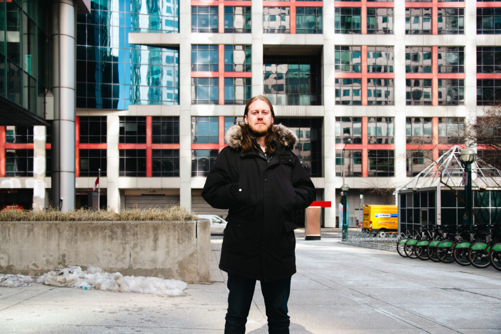 A photo of Julian Uzielli across the street from the CBC Toronto headquarters.