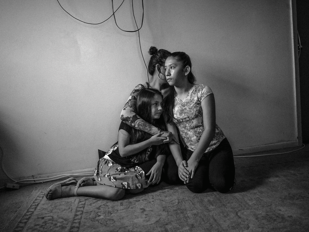 Maria and her daughters in their midwest home. Her husband, Eberardo, a Mexican immigrant, survived a deadly boat collapse.