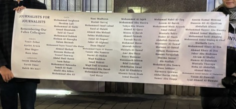 Volunteers hold a list of names of journalists killed since Oct. 7, 2023 at 55 Gould St., Toronto on Feb 1, 2024. According to the Committee to Protect Journalists' preliminary investigation, as of Jan. 31, 2024, 78 Palestinian, 4 Israeli, and 3 Lebanese have been killed. According to the Palestinian Journalists Syndicate and International Federation of Journalists, the toll is even higher. 