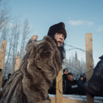 Sabina Dennis stands her ground as police dismantle the barricade to enforce the injunction filed by the Coastal Gaslink pipeline at the Gidimt’en checkpoint near Houston, B.C., on January 7, 2019. The pipeline company was given a permit but the Office of the Wet’suwet’en, which has jurisdiction over the territory in question, has never given consent Photo: Amber Bracken