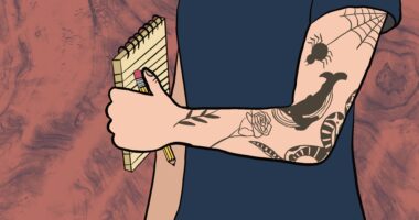 A tattooed arm holds a pen and a notepad