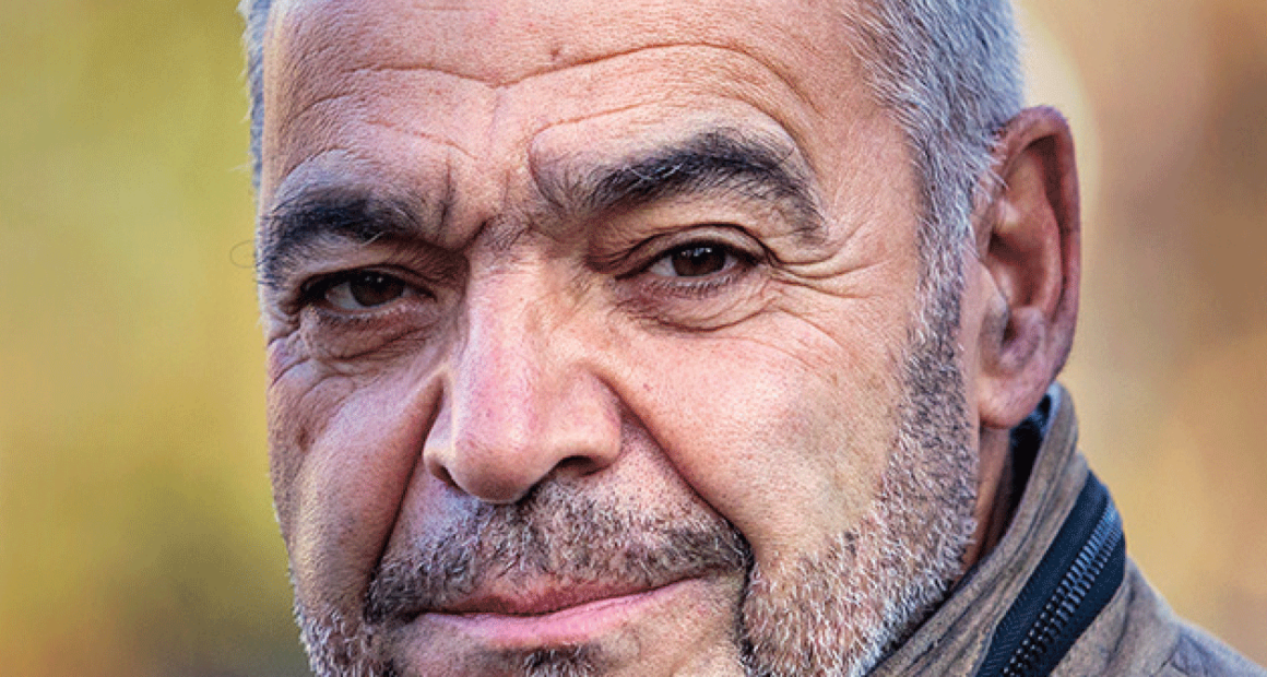 Julian Sher looks at the camera in a portrait photo