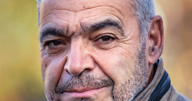 Julian Sher looks at the camera in a portrait photo