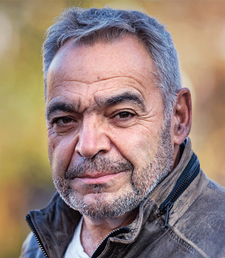 Julian Sher looks at the camera in a portrait photo