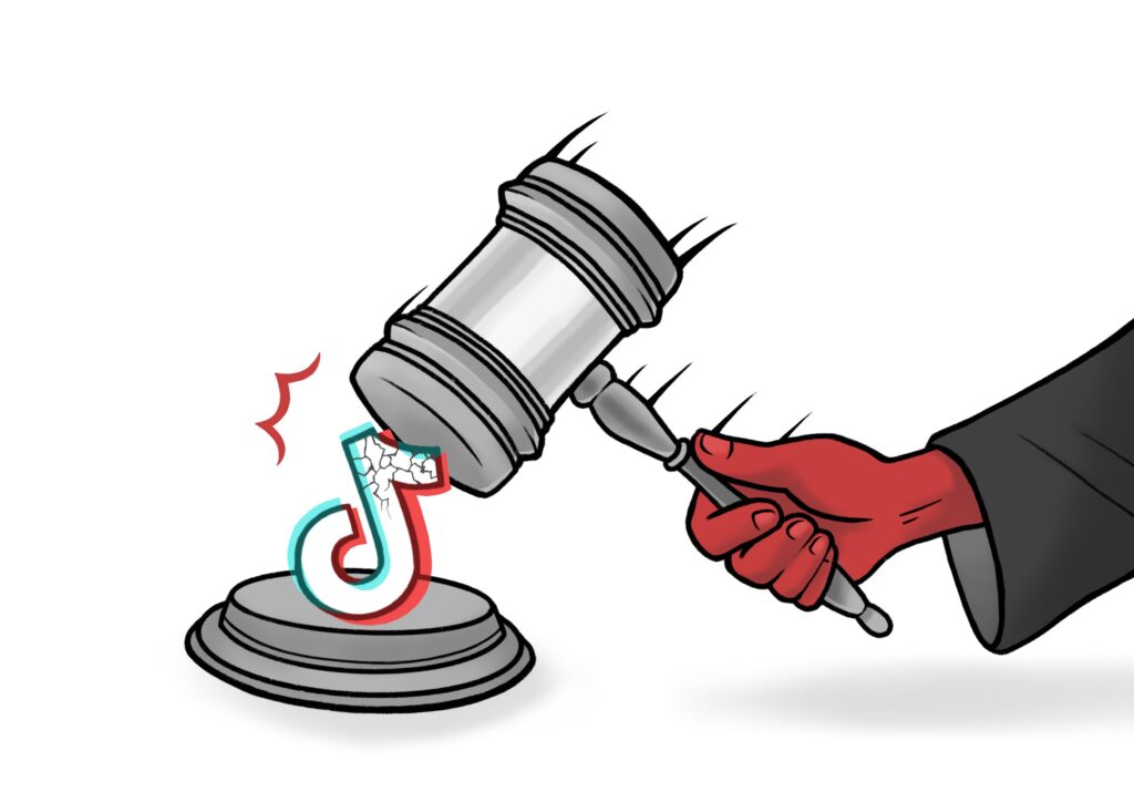 A red hand is illustrated, with a gray sleeve, holding a gray judges gavel. The gavel is mid-swing pictured hammering a cracking TikTok logo.