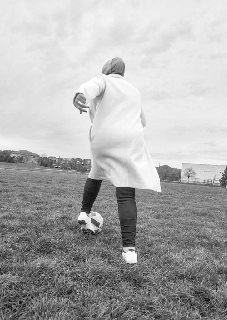 Shireen Ahmed dribbles a soccer ball on a soccer pitch